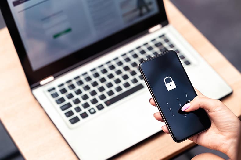iStock 1307162571 Phone password lock for mobile cyber security or login verification passcode in online bank app. Data privacy and protection from hacker, identity thief or cybersecurity threat.